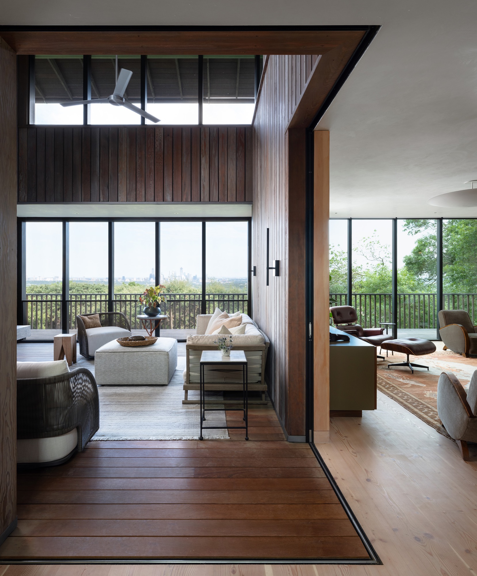 Hillside House screened porch opening to the living room in West Lake Hills, Texas